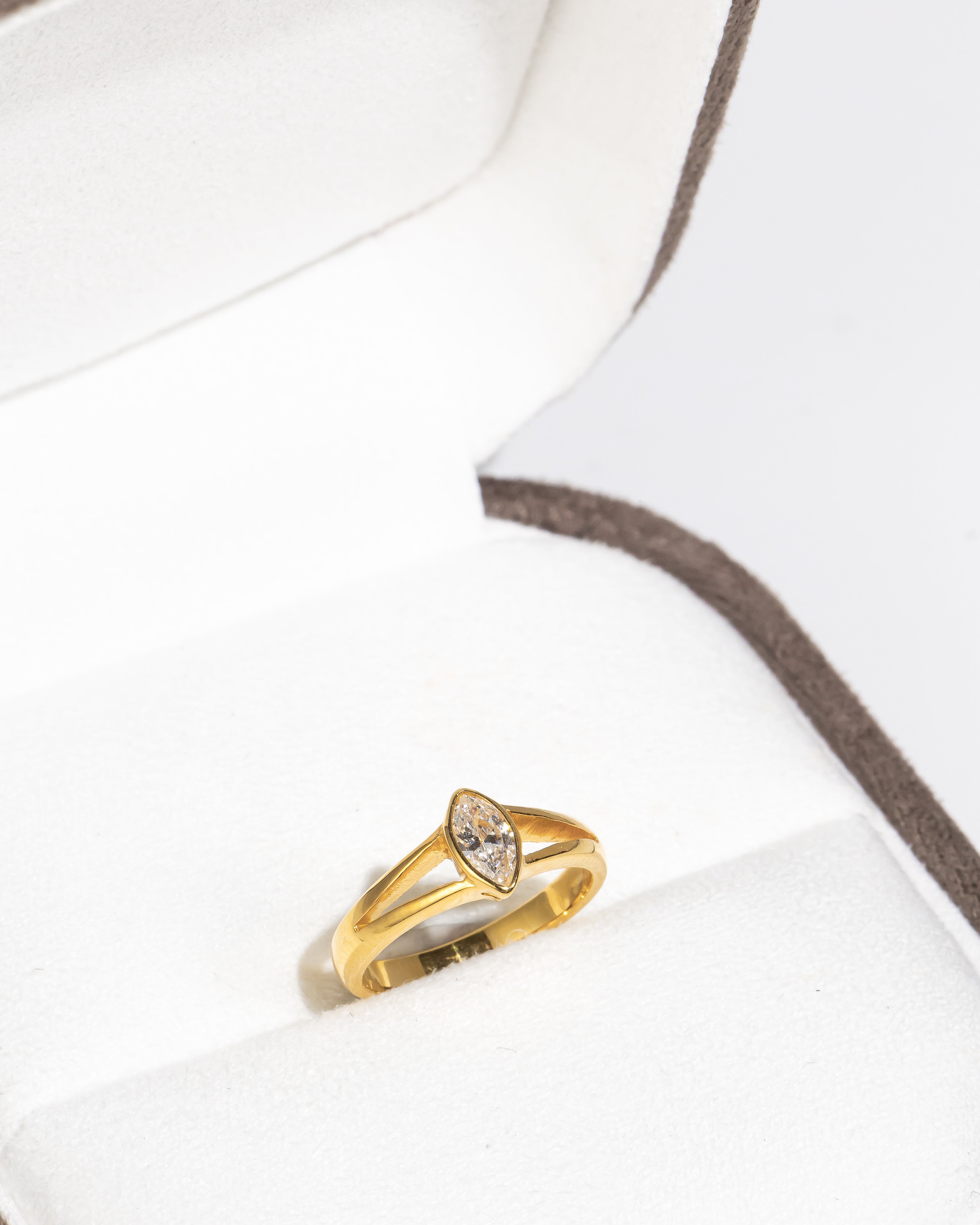 Minimal Thin Gold Ring with Diamond-Cut Pear-Shaped Diamond