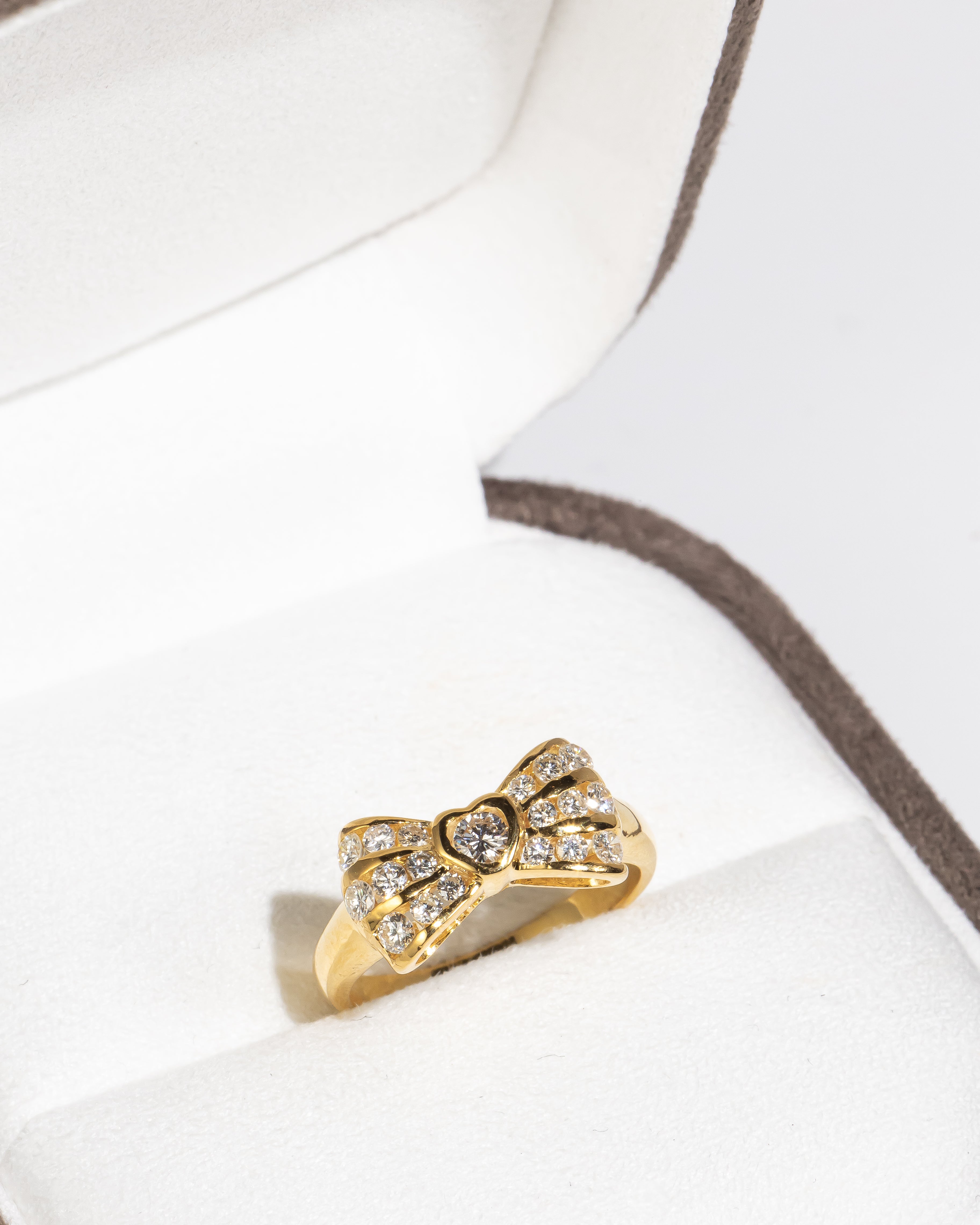 Bow-Shaped Diamond Gold Ring with Heart Detail